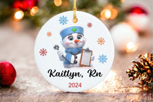 Load image into Gallery viewer, Personalized Nurse Snowman Ornament - Ceramic, UV Printed, with Name & Year, Round, Gift Boxed - Perfect for Nurses!