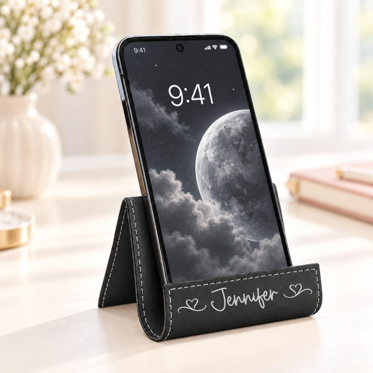 Black phone stand with silver engraving, name Jennifer with scroll heart design