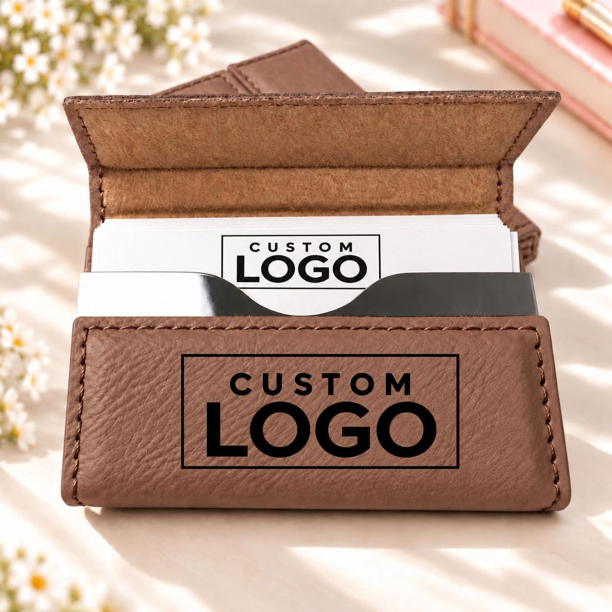 Brown business card holder engraved with a custom logo